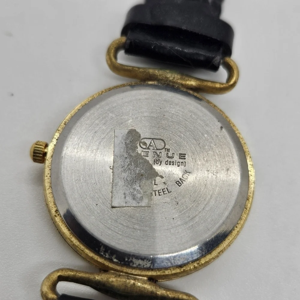 vintage Avenue by Design black and gold tone watch with iridescent digits